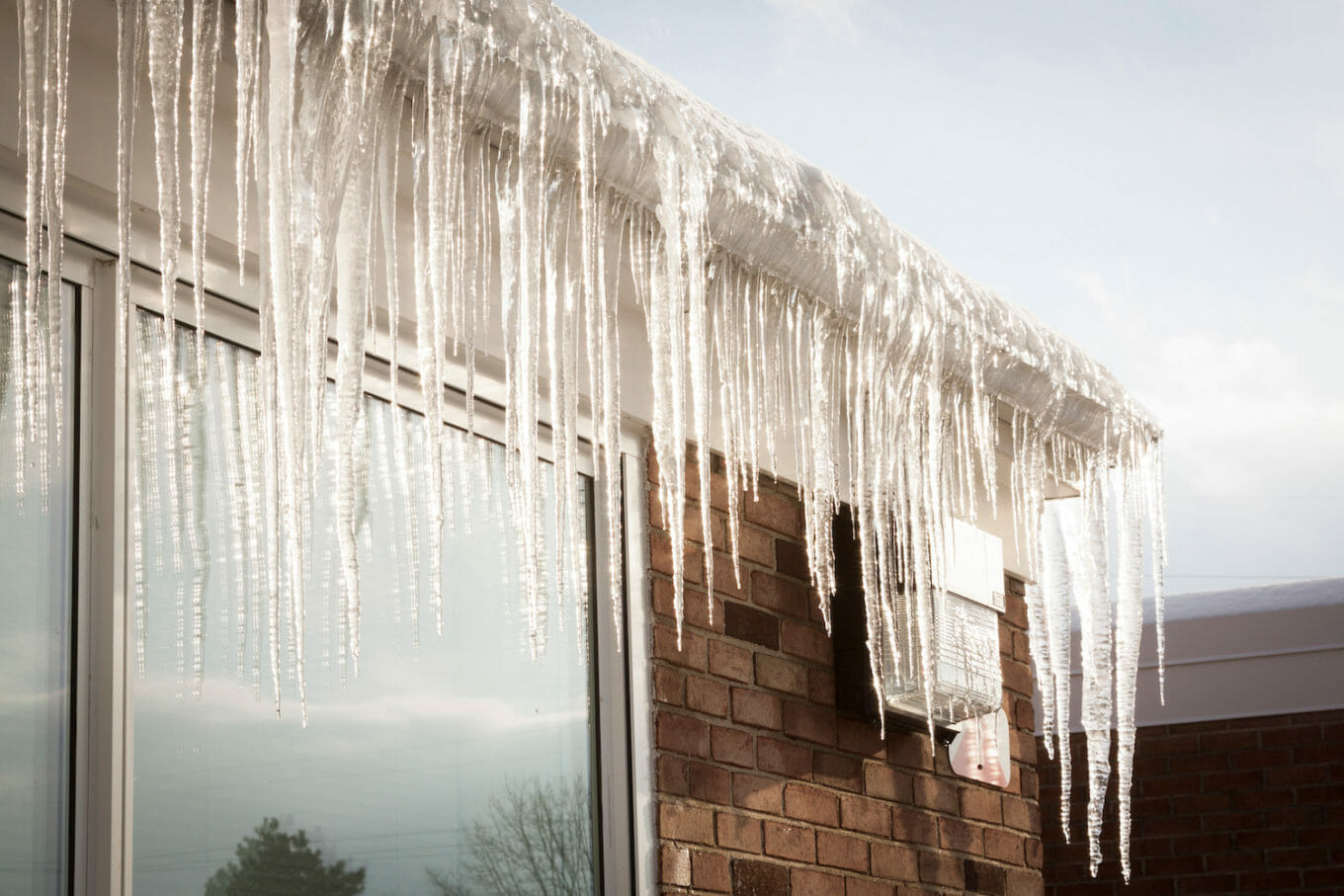 when to replace roof materials icicles hanging from roof gutters