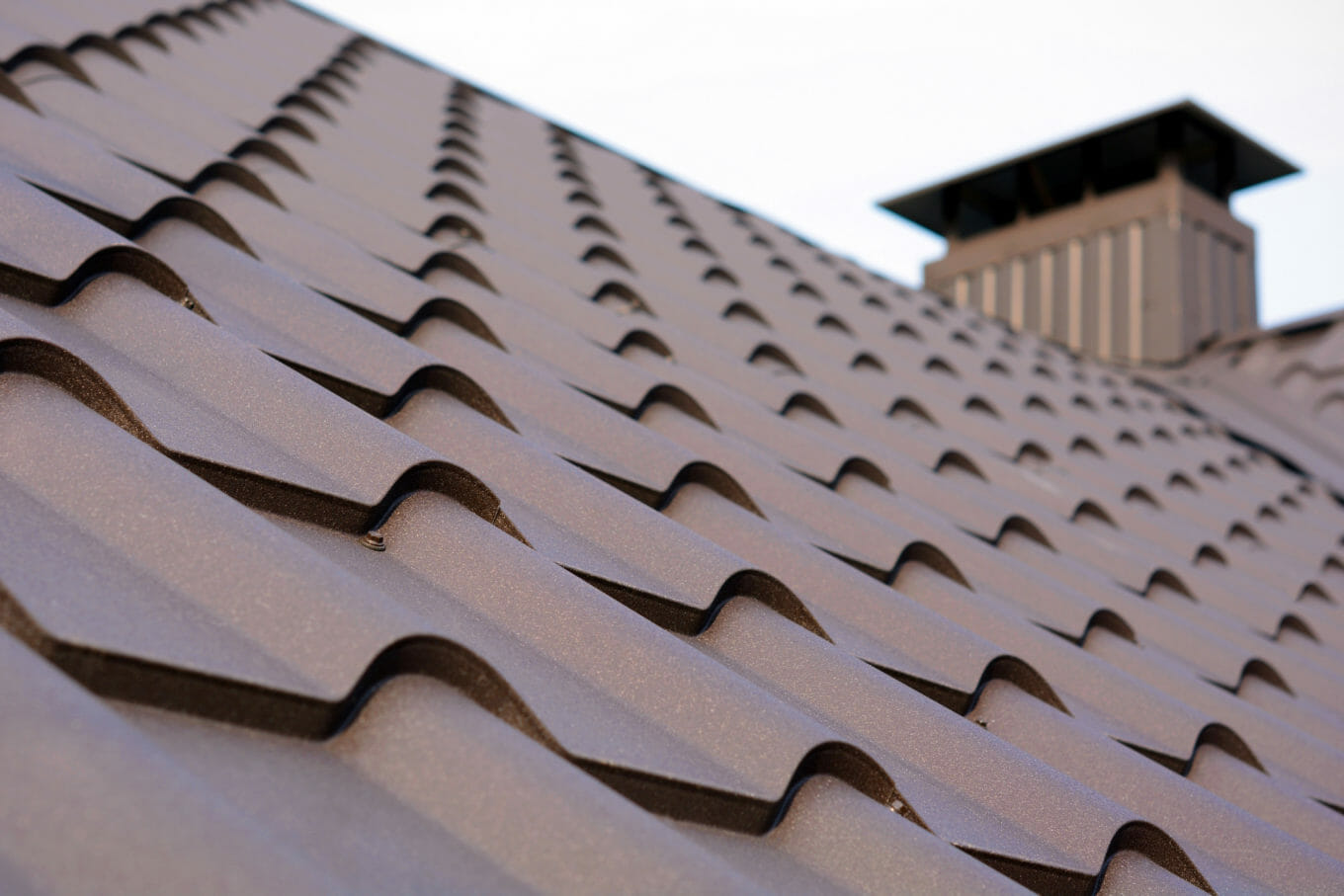 close up of brown metal roof shingles