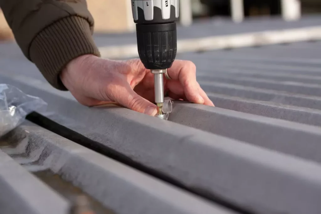 installing fasteners on metal roof